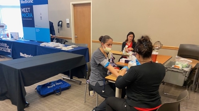 Event attendees getting blood pressure checks. Photo