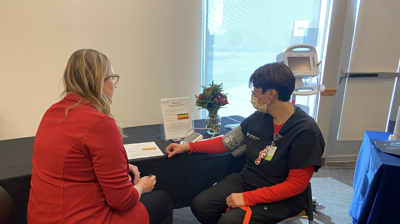Event attendees getting blood pressure checks. Photo