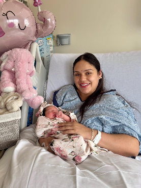 Irma holding newborn baby