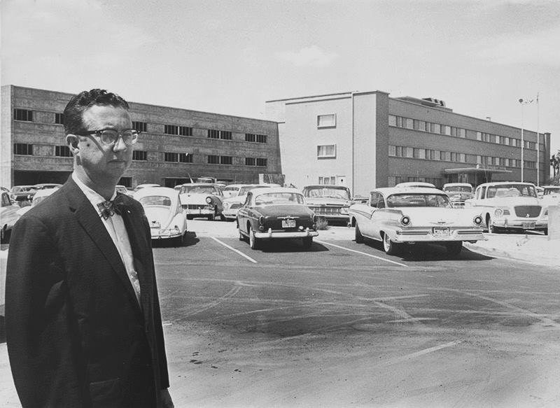 A person standing in a parking lot