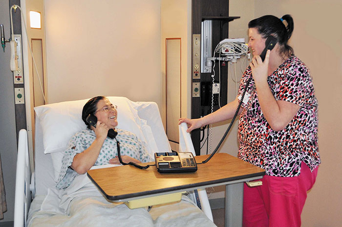 smiling patient on the phone