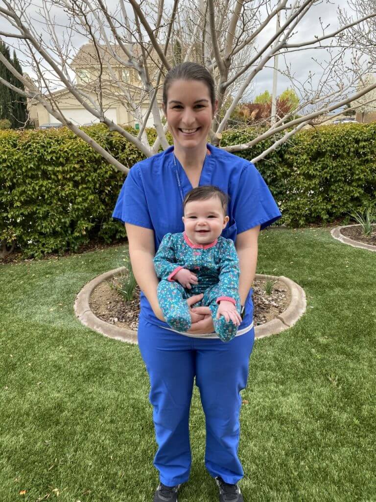Dr. Ellison holding her happy baby