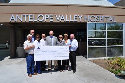 group of people holding check