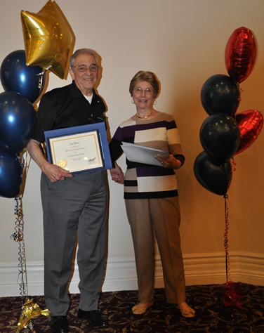 Joe Silva and Shirley Beasley holding awards