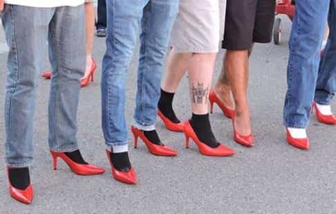 men wearing red high heels